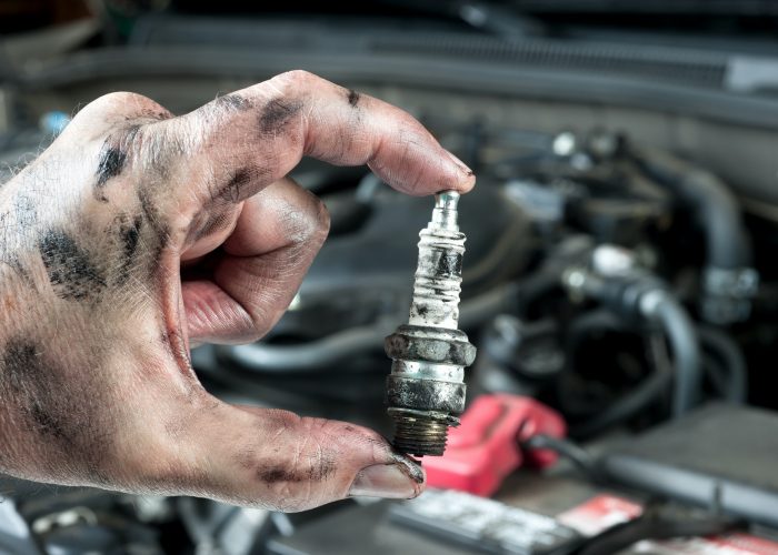 Auto mechanic and sparkplug